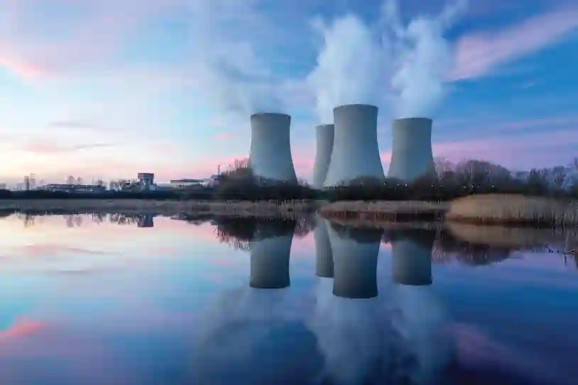 Nuclear power plants at the edge of a lake during a sunset
