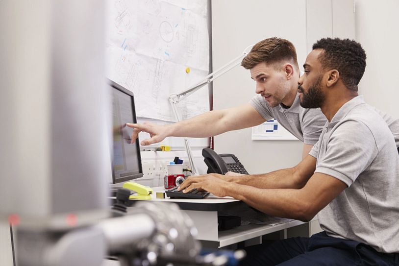 Men looking at screen