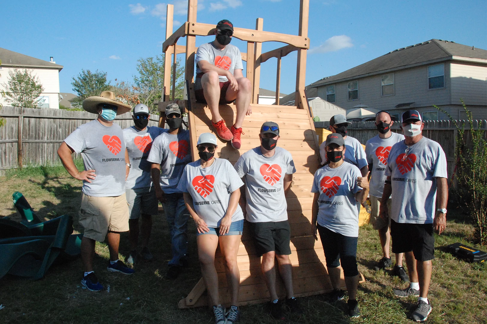 Flowserve volunteers join together after a hard-day’s work at the site