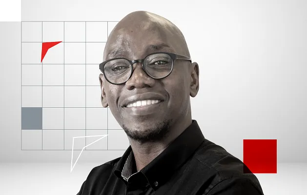 Smiling Man with Eyeglasses on a Grid Background